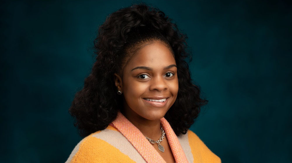 headshot of a smiling Re’Jahnique Matthews